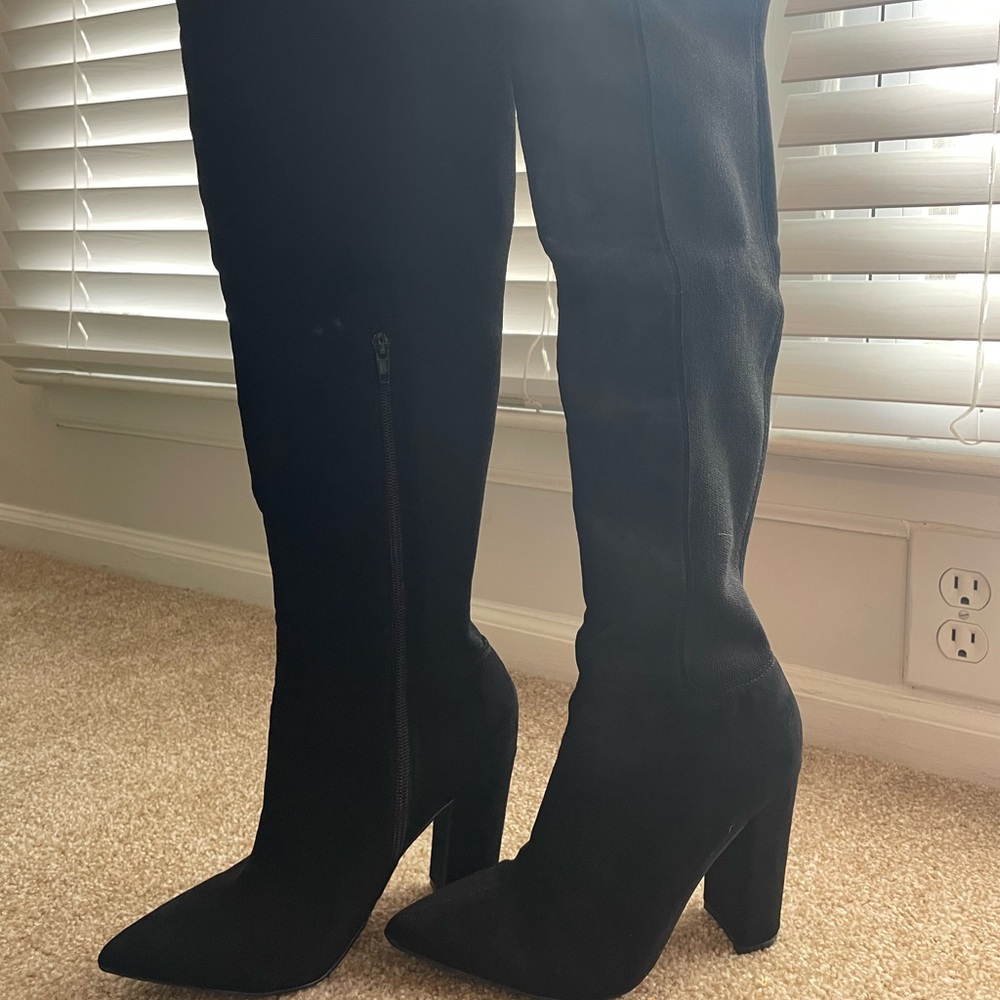 Over the knee boots from EXPRESS. Only wore them for two hours. Almost BRAND NEW
